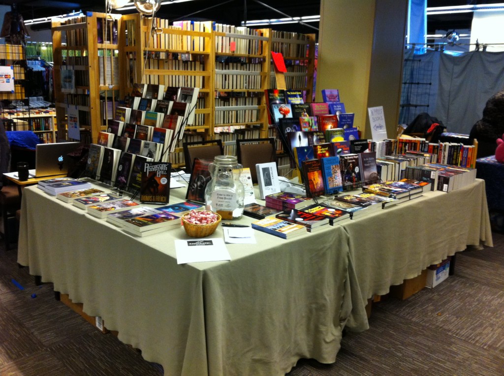 The Fantastic Books table in the dealers' room of Arisia 2015, feeling pretty walled-in.